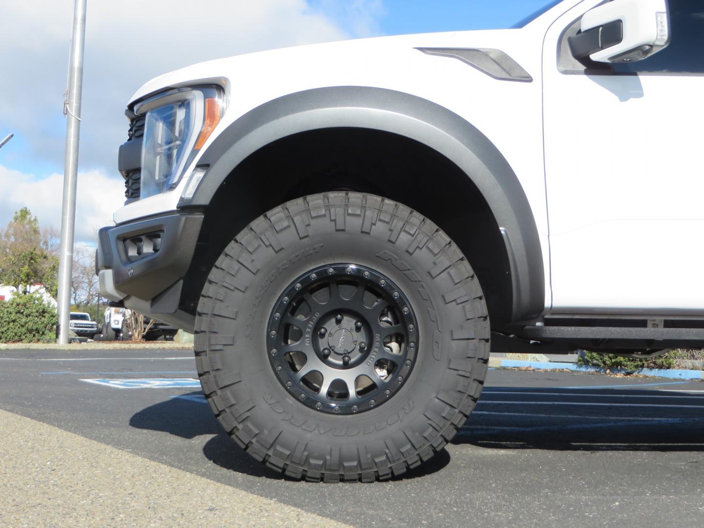 2023 White /BLACK Ford F-150 Raptor SuperCrew 4WD (1FTFW1RG6PF) with an 3.5 V6 engine, 6A transmission, located at 2630 Grass Valley Highway, Auburn, CA, 95603, (530) 508-5100, 38.937893, -121.095482 - Raptor sitting on Eibach front and rear springs, 37" Nitto Ridge Grappler tires, 17" Method NV wheels, and window tint. - Photo#7